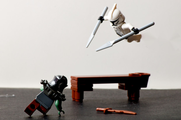 Two lego figures playing with each other