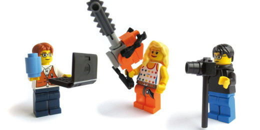 Three lego figures standing next to each other